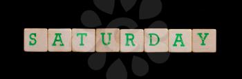 Saturday spelled out in old wooden blocks