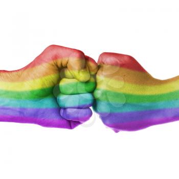 Mans hand and womans hand as fists together, rainbow flag pattern