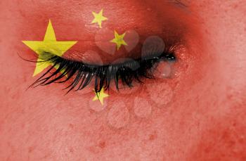 Crying woman, pain and grief concept, flag of China