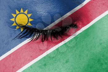 Crying woman, pain and grief concept, flag of Namibia