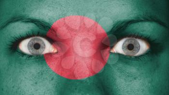 Close up of eyes. Painted face with flag of Bangladesh