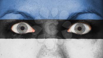 Close up of eyes. Painted face with flag of Estonia