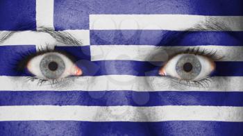 Close up of eyes. Painted face with flag of Greece