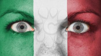 Close up of eyes. Painted face with flag of Italy