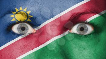 Close up of eyes. Painted face with flag of Namibia