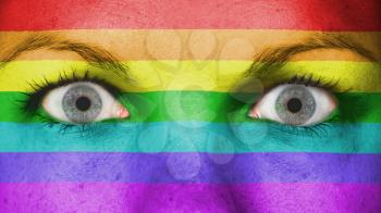 Close up of eyes. Painted face with rainbow flag