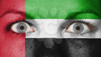 Close up of eyes. Painted face with flag of United Arab Emirates