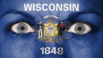 Close up of eyes. Painted face with flag of Wisconsin