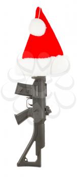 Weapon (firearm) concealed in santas hat, isolated on canvas