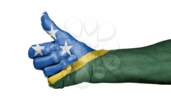 Old woman giving the thumbs up sign, isolated, flag of The Solomon Islands