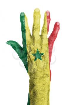 Hand of an old woman wrapped in flag of Senegal