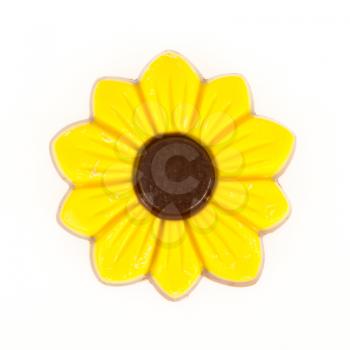 Yellow chocolate flower, isolated on a white background