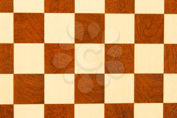 Very old wooden chess board, isolated close-up