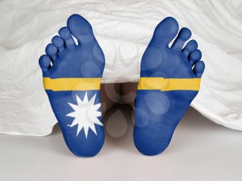 Feet with flag, sleeping or death concept, flag of Nauru