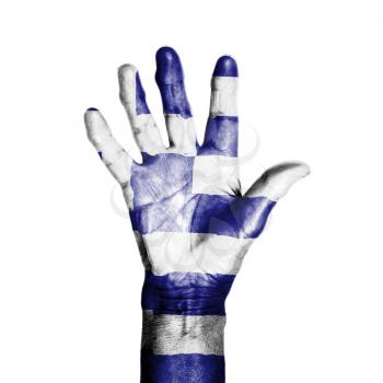 Hand of an old woman, wrapped with a pattern of the flag of Greece, isolated on white