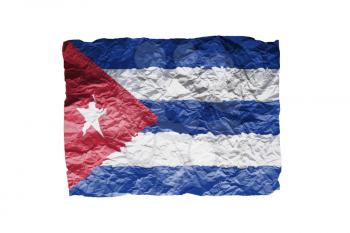 Close up of a curled paper on white background, print of the flag of Cuba