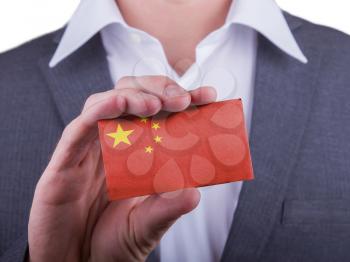 Businessman showing card, matte paper effect, China