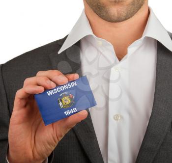 Businessman is holding a business card, flag of Wisconsin