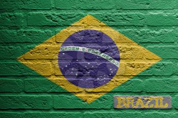 Brick wall with a painting of a flag isolated, Brazil