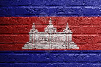 Brick wall with a painting of a flag isolated, Cambodia