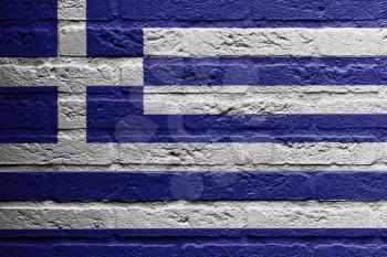Brick wall with a painting of a flag isolated, Greece