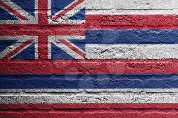 Brick wall with a painting of a flag isolated, Hawaii