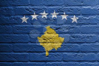Brick wall with a painting of a flag isolated, Kosovo