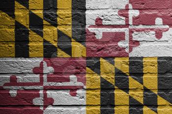 Brick wall with a painting of a flag isolated, Maryland