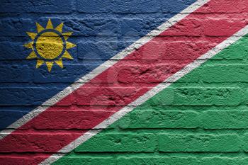 Brick wall with a painting of a flag isolated, Namibia