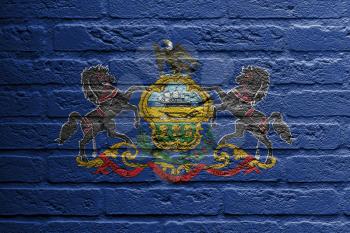 Brick wall with a painting of a flag isolated, Pennsylvania