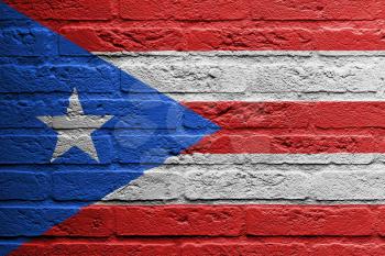 Brick wall with a painting of a flag isolated, Puerto Rico