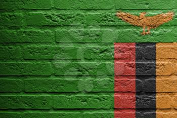 Brick wall with a painting of a flag isolated, Zambia