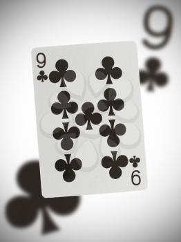 Playing card with a blurry background, nine