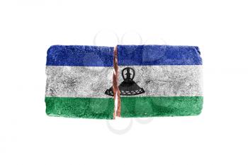 Rough broken brick, isolated on white background, flag of Lesotho
