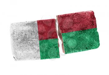 Rough broken brick, isolated on white background, flag of Madegascar