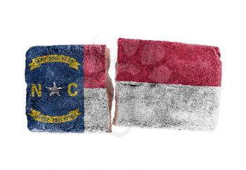 Rough broken brick, isolated on white background, flag of North Carolina