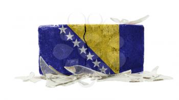 Brick with broken glass, violence concept, flag of Bosnia Herzegovina