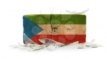 Brick with broken glass, violence concept, flag of Equatorial Guinea