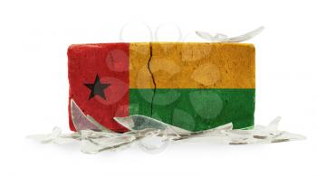 Brick with broken glass, violence concept, flag of Guinea-Bissau