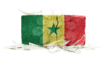 Brick with broken glass, violence concept, flag of Senegal