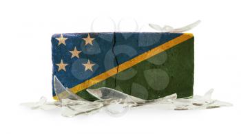 Brick with broken glass, violence concept, flag of The Solomon Islands