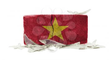 Brick with broken glass, violence concept, flag of Vietnam