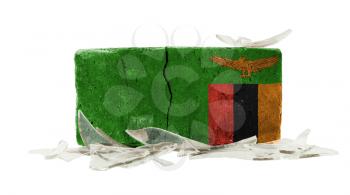 Brick with broken glass, violence concept, flag of Zambia