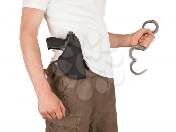 Close-up of a man with holster and a gun, isolated on white