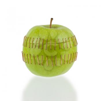 Sliced apple halves joined by brass staples