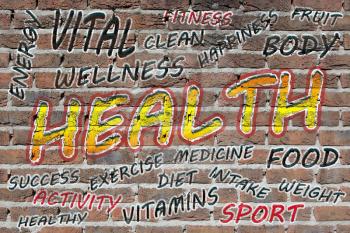 Health word cloud painted with grafitti on a brick wall