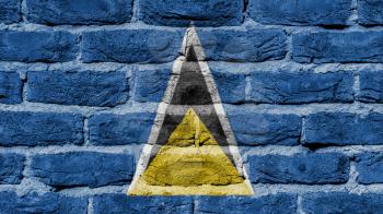 Very old brick wall texture, flag of Saint Lucia