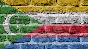 Very old brick wall texture, flag of the Comoros