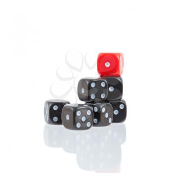 Row of black dice, selective focus on the red die