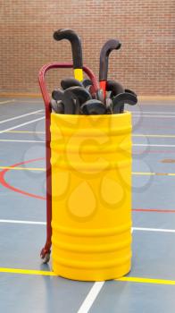 Hockeysticks in an old school gym, Holland